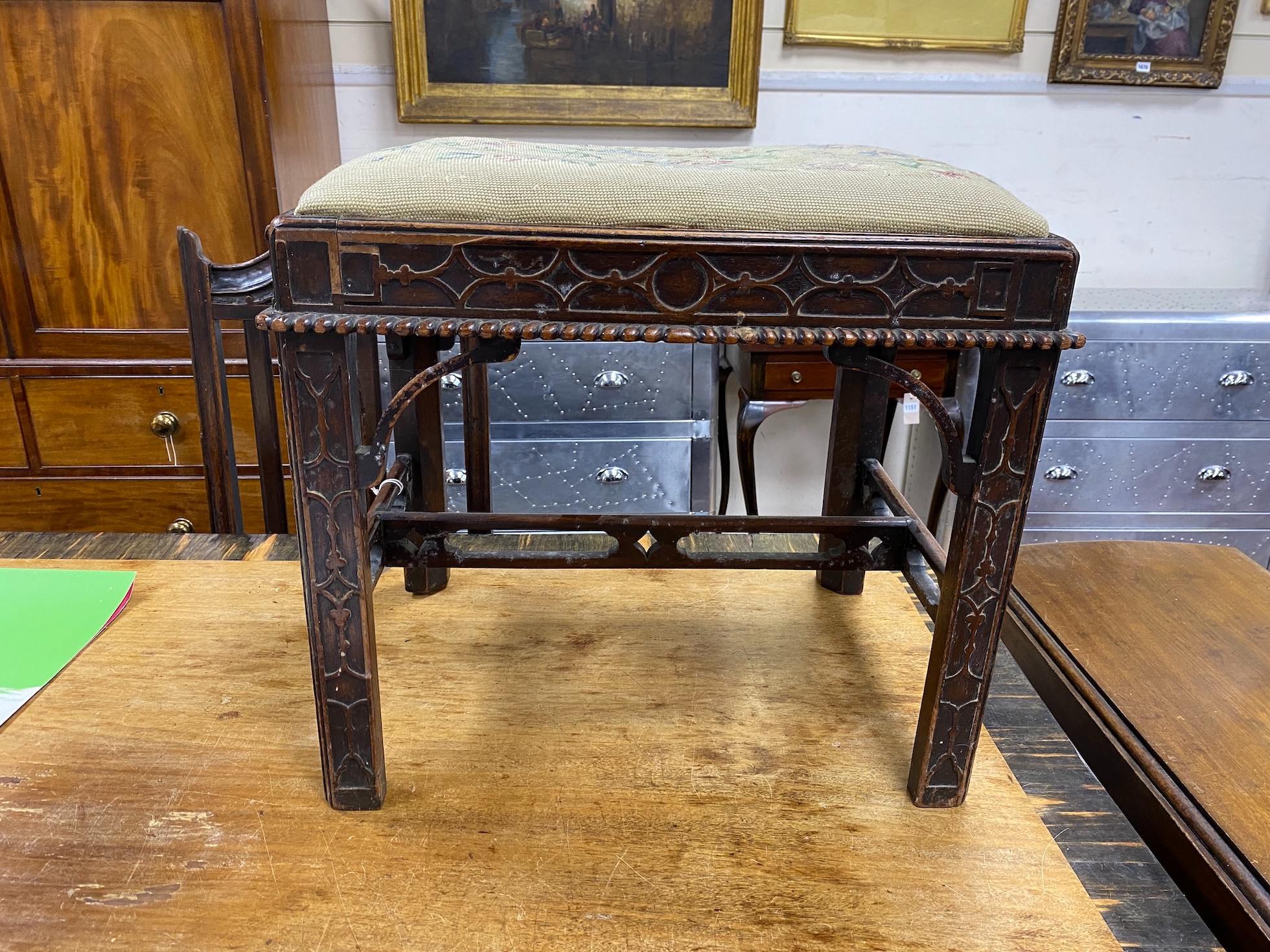 A Chippendale revival mahogany dressing stool with needlework drop in seat and blind fret carving, width 53cm, height 47cm